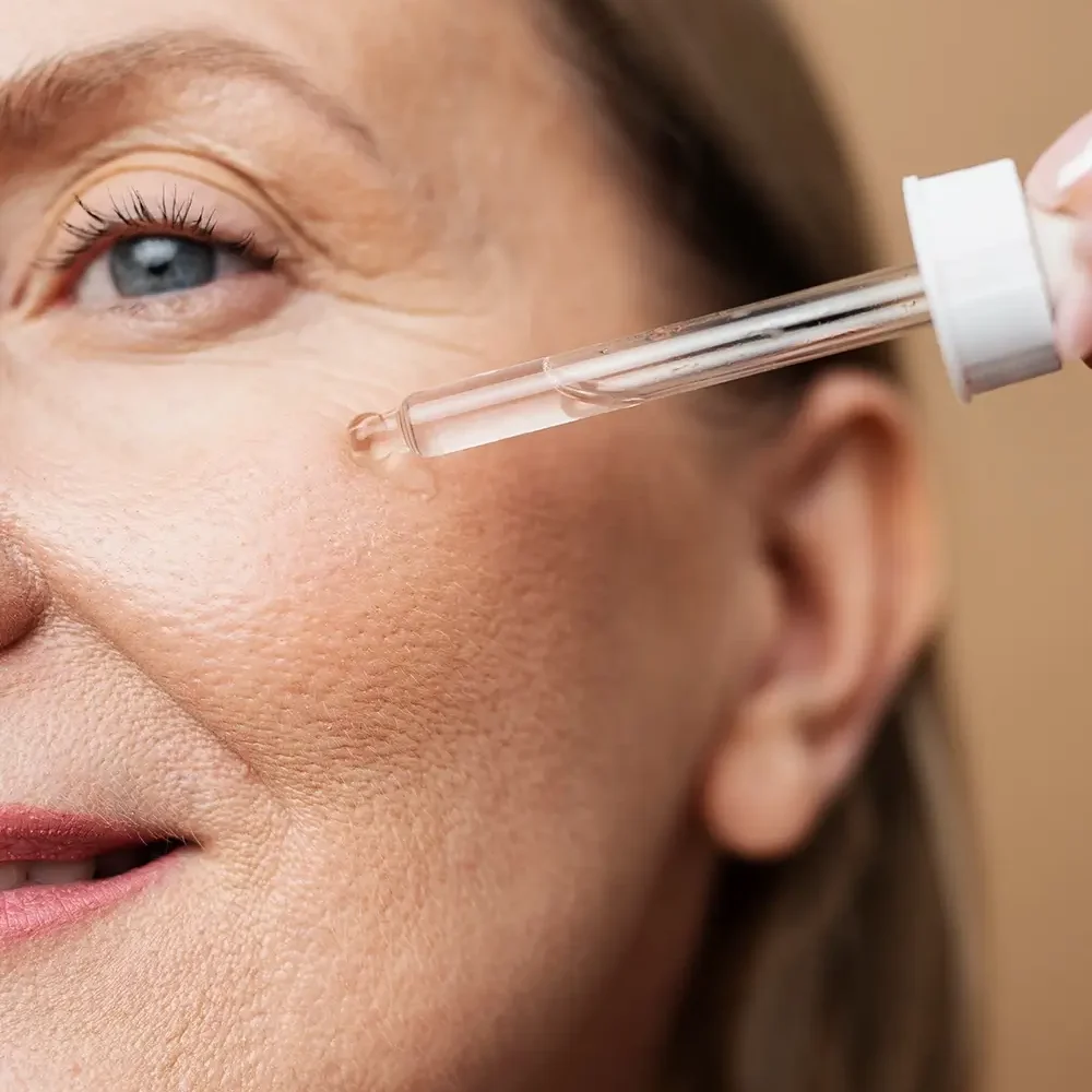 close-up-senior-woman-using-serum copy (1)